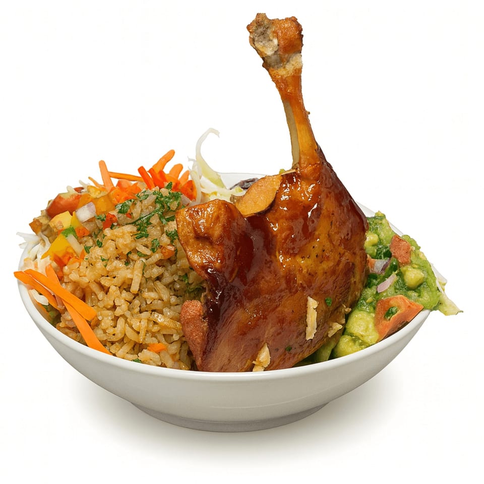 Cuban duck confit with rice, guacamole, and shredded vegetables in a white bowl.